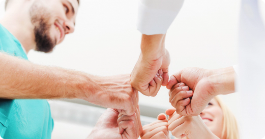 Healthcare Team fist bump.