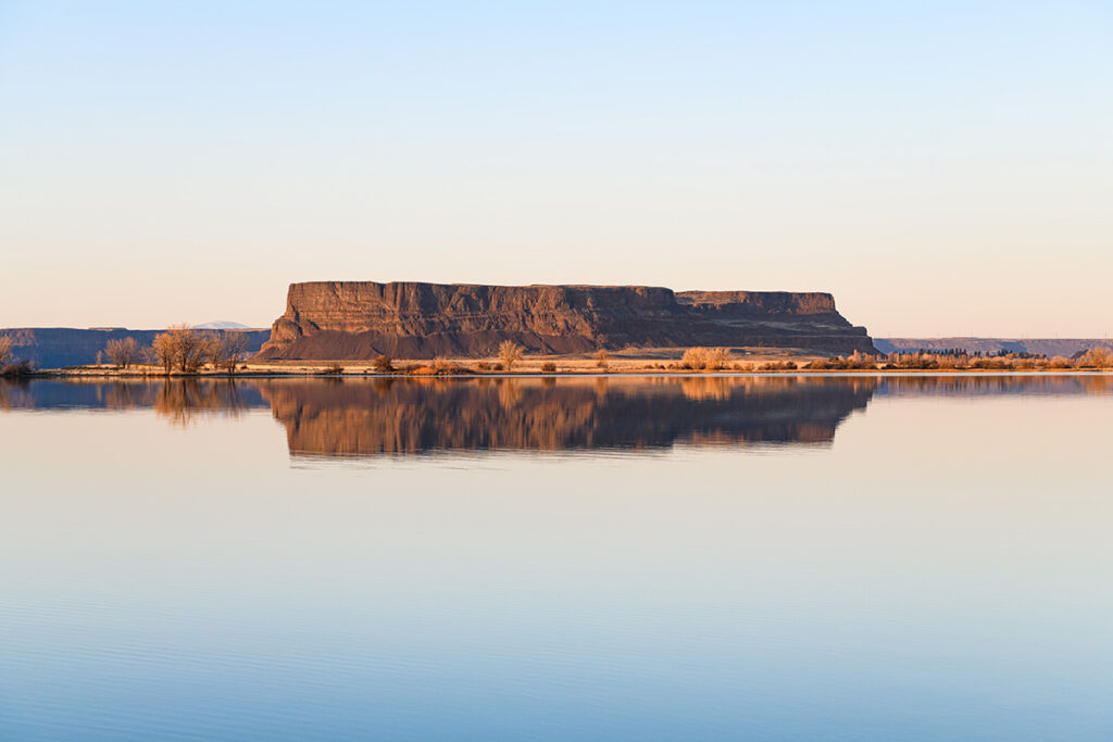 Steamboat Rock rising above Banks Lake in Eastern Washington State on a crisp winter evening